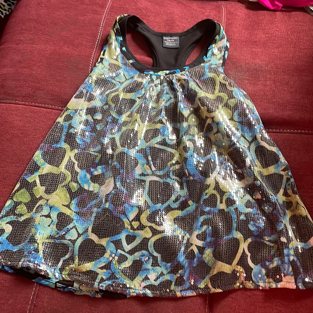 This is a casual/dressy shirt that is black , green , blue , white , and purple